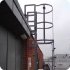 Ladder with safety cage